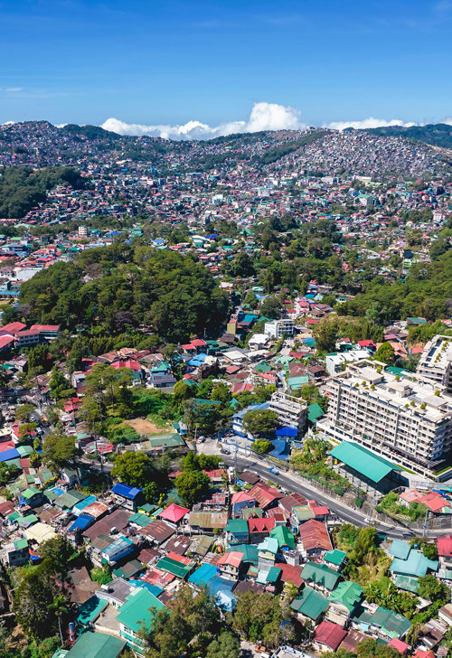 a city with many buildings and trees