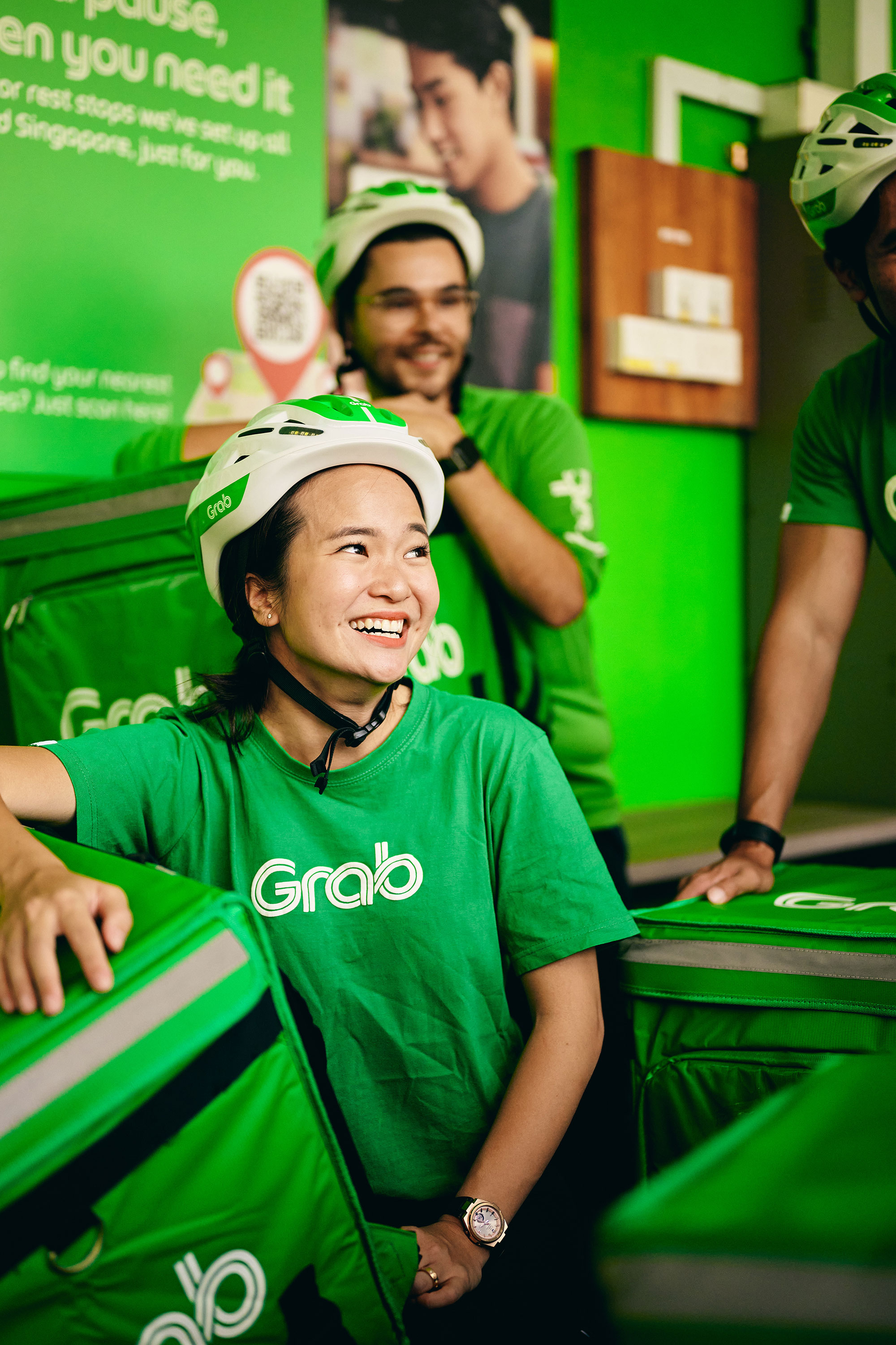 a group of people wearing green shirts