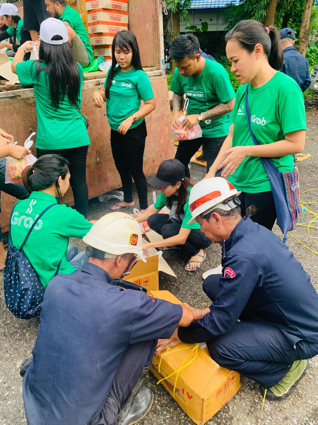 a group of people in green shirts