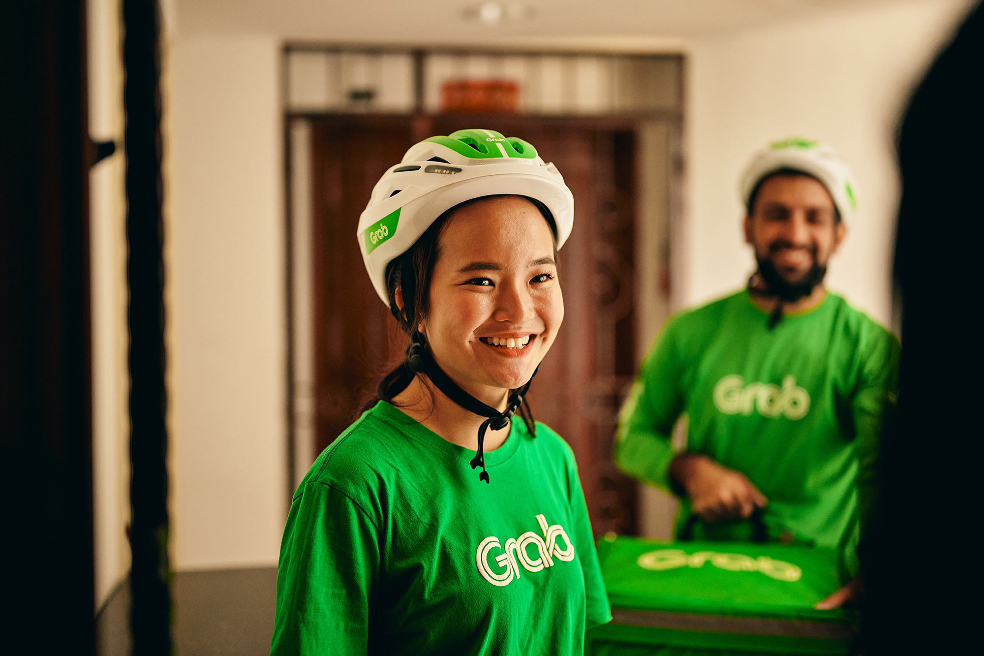 a woman wearing a helmet and smiling