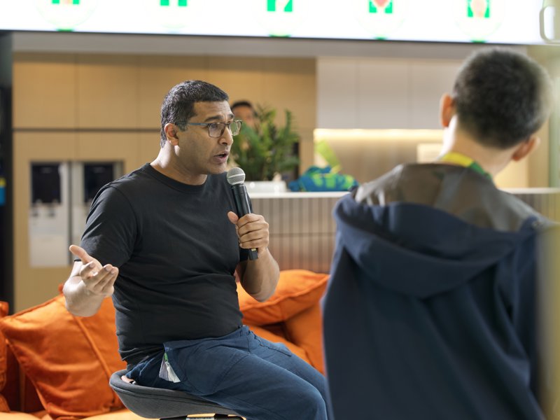 a person sitting in a chair talking to a person