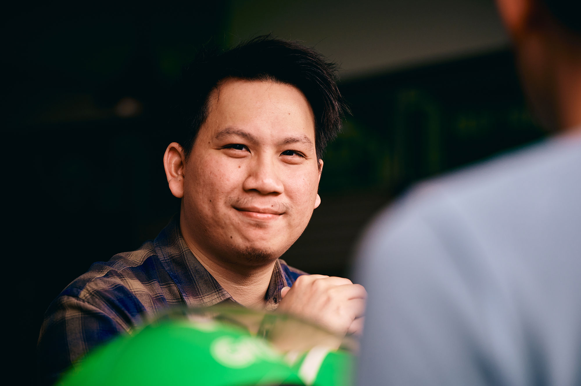 a man smiling at another man