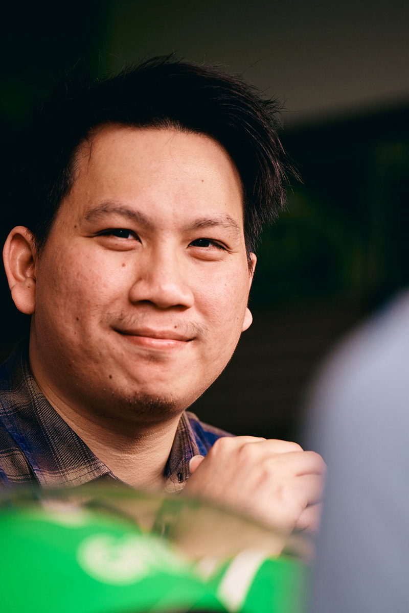a man smiling at another man