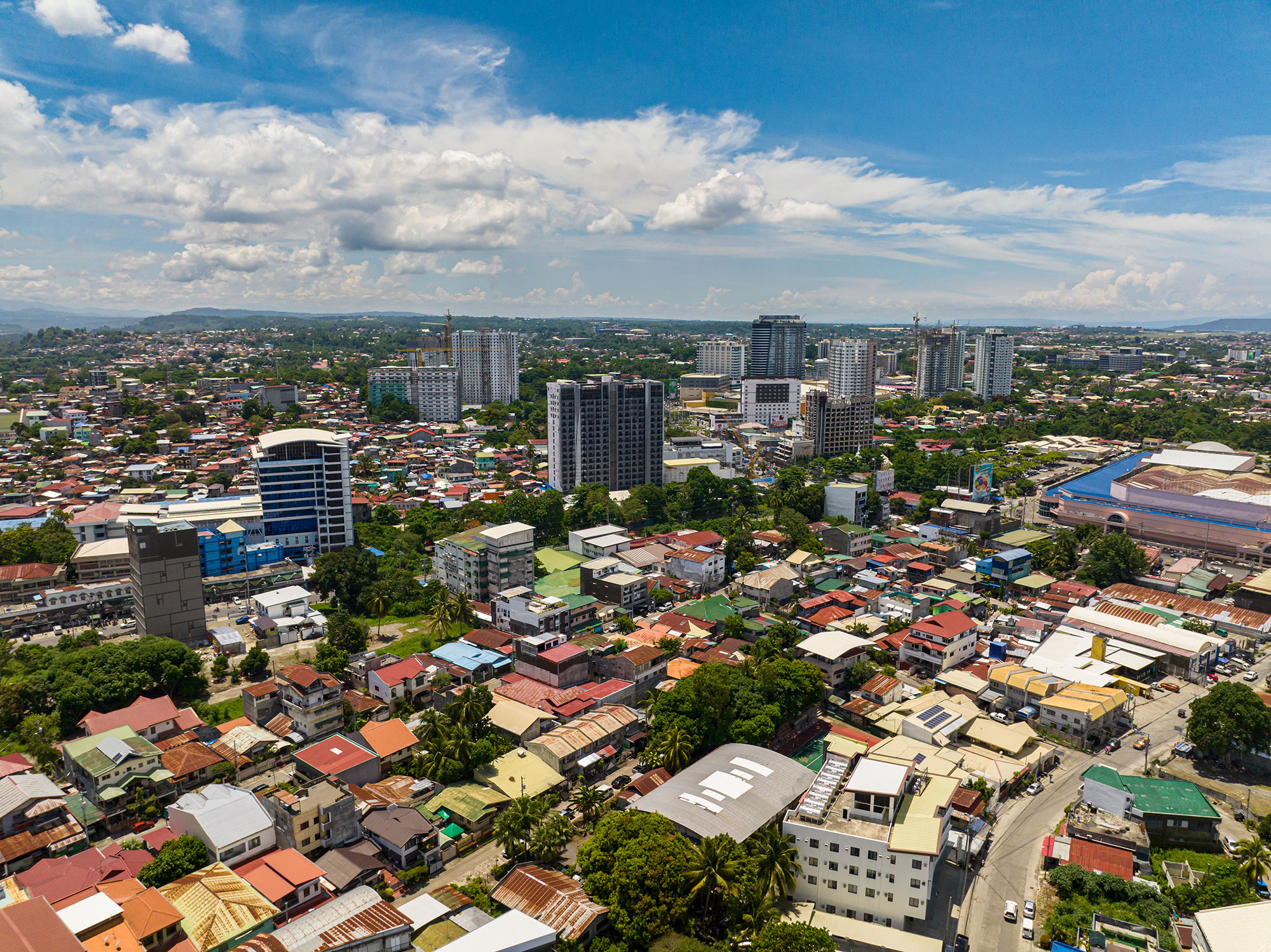 a city with many buildings and trees