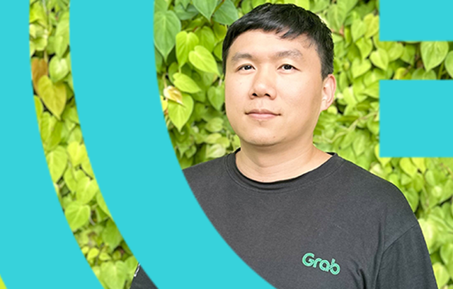 a person standing in front of a green bush