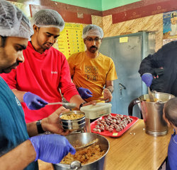 a group of men in a kitchen