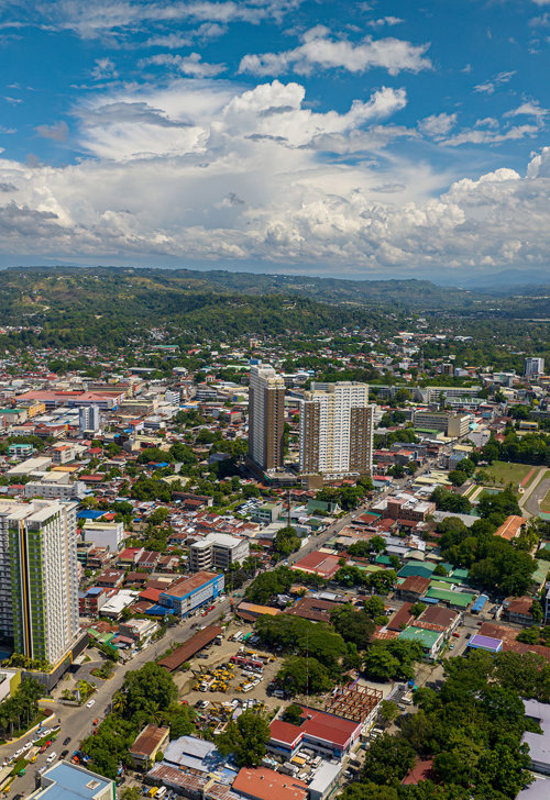 a city with many buildings and trees
