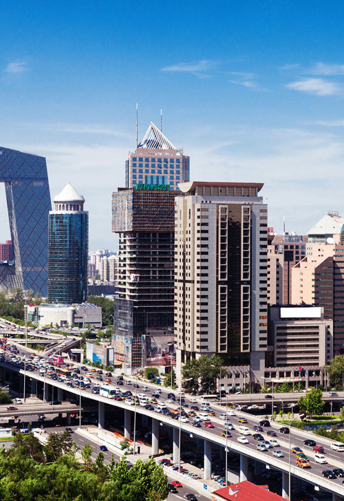 a city with many cars and a bridge