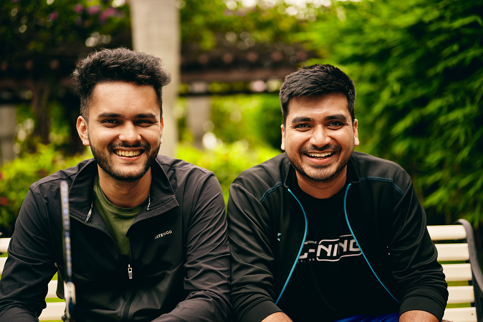 two men smiling at the camera