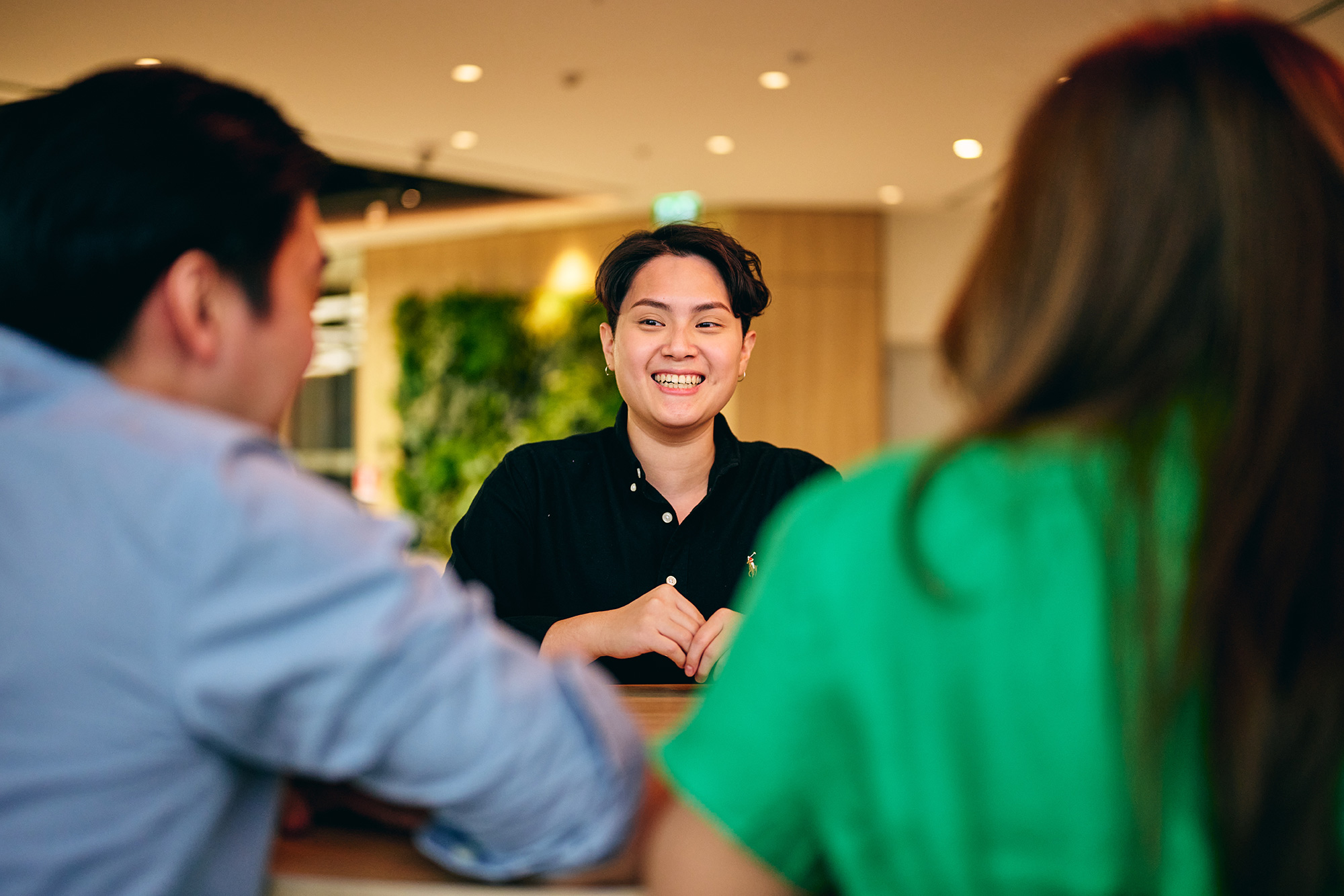 a woman smiling at a man