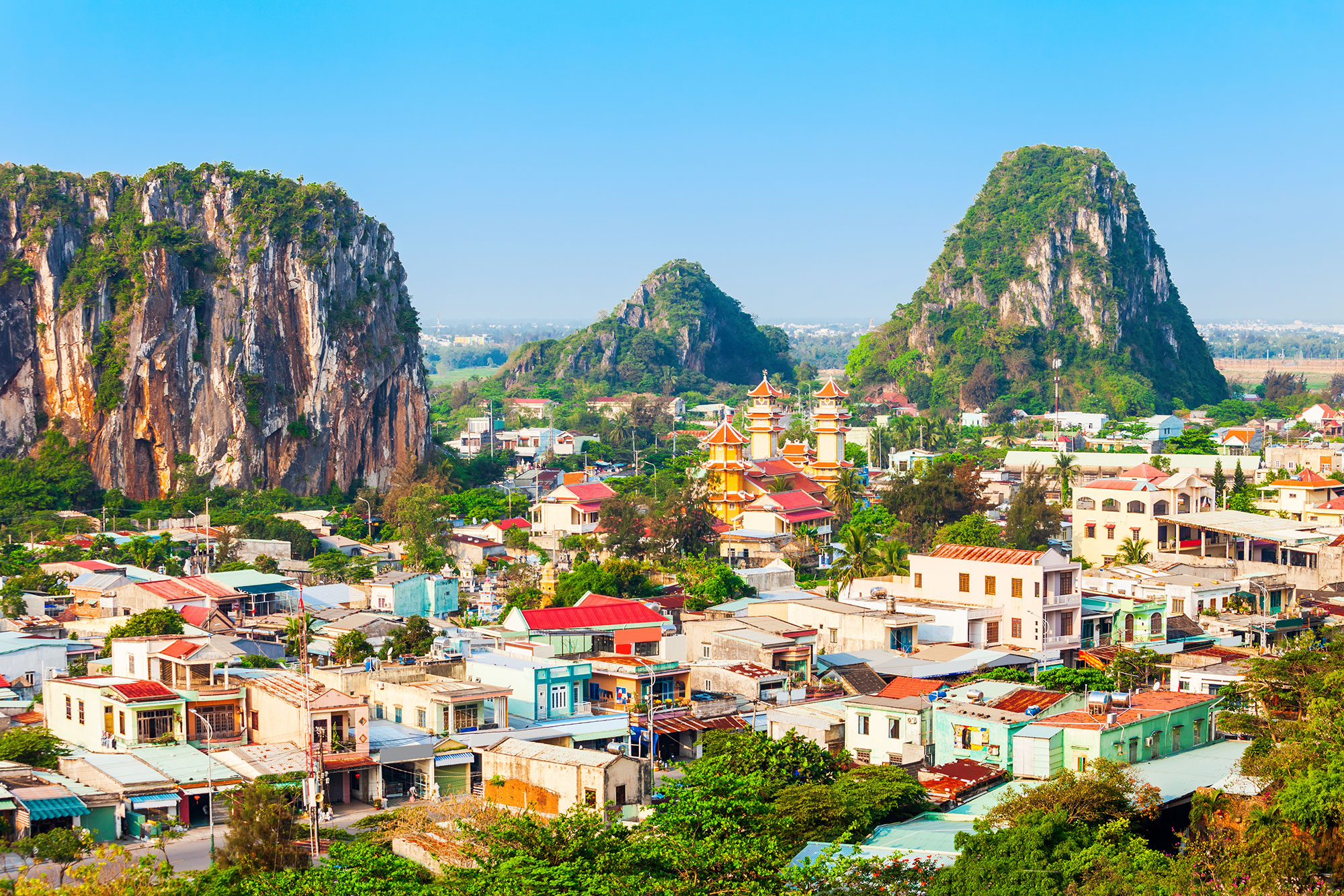 a city with many buildings and large rocks