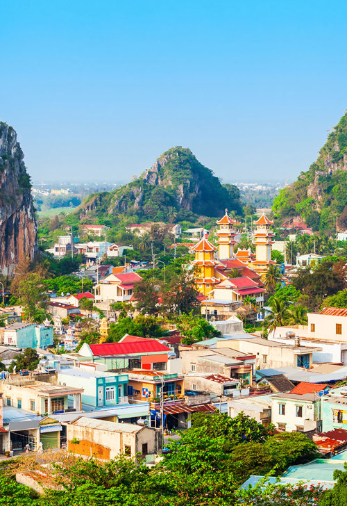 a city with many buildings and large rocks
