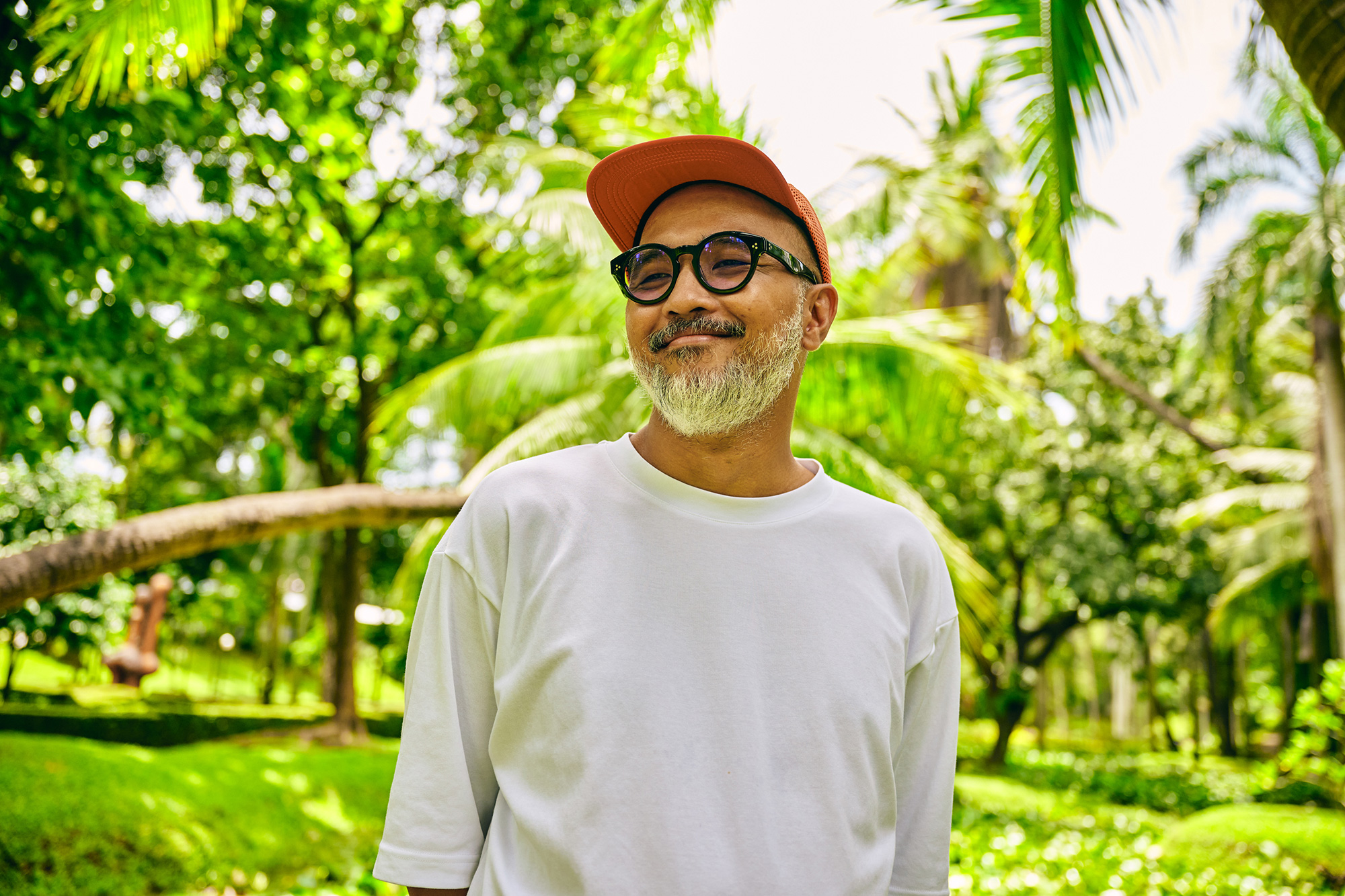 a man in a white shirt and red hat