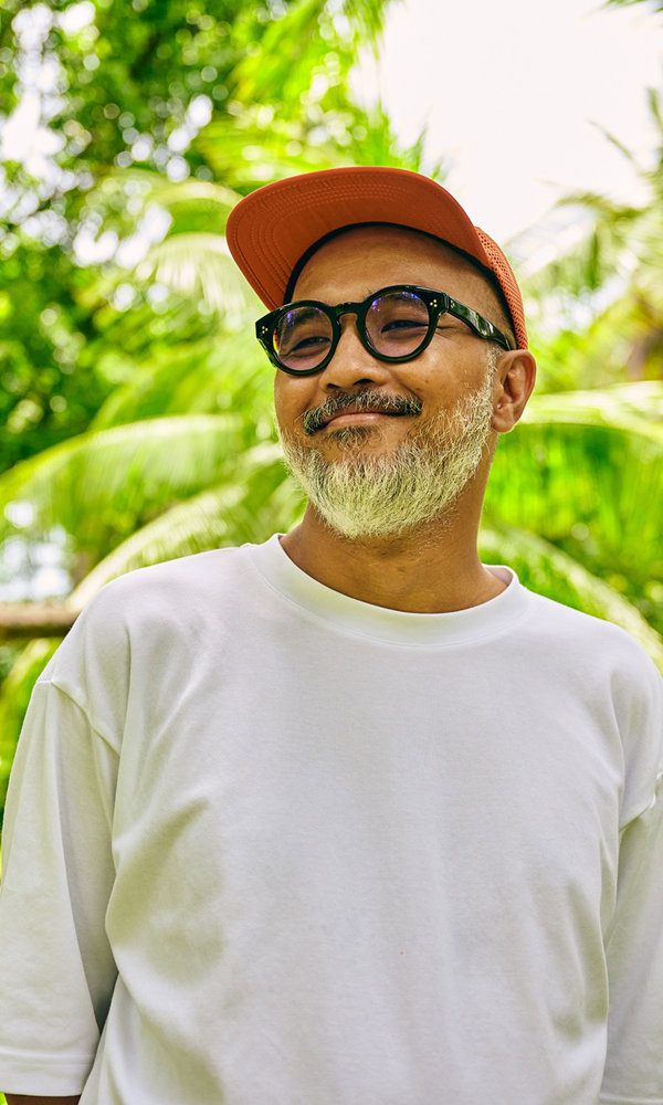 a man in a white shirt and red hat