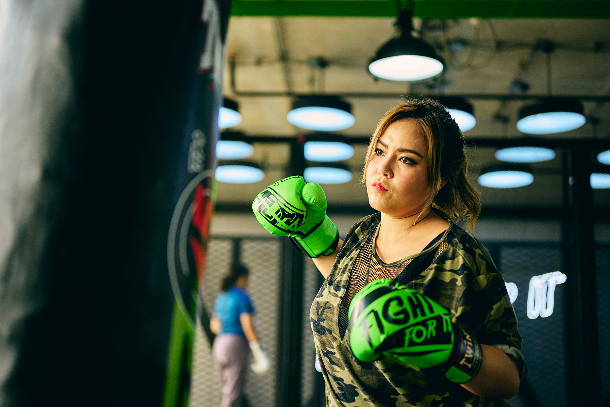 a woman wearing boxing gloves