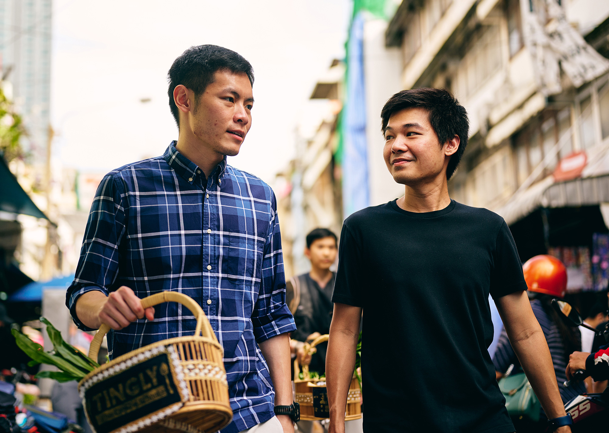 two men walking down a street