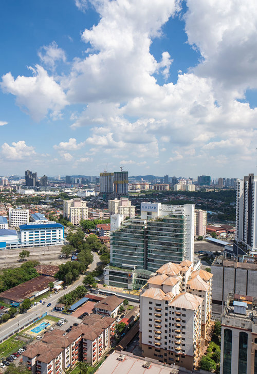 a city with many buildings and a road