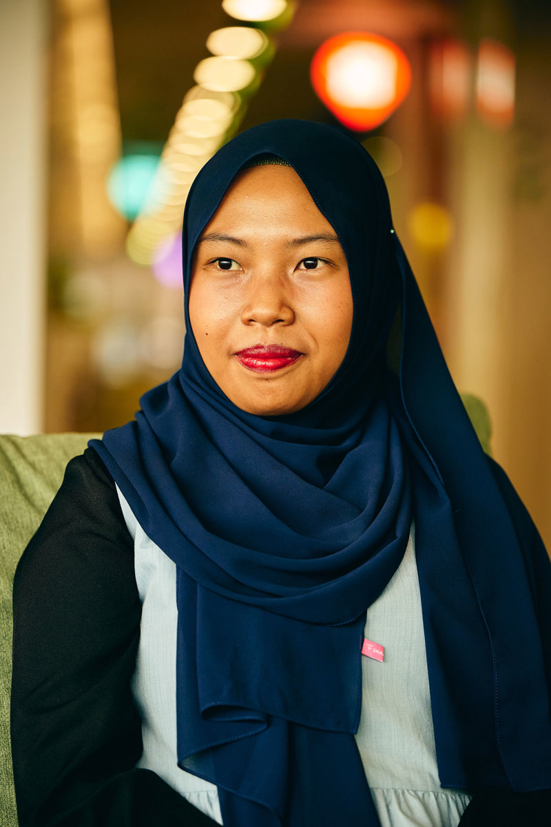 a woman wearing a blue scarf