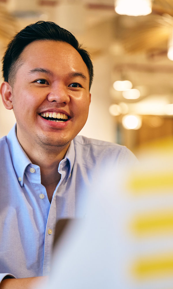 a man smiling at another man