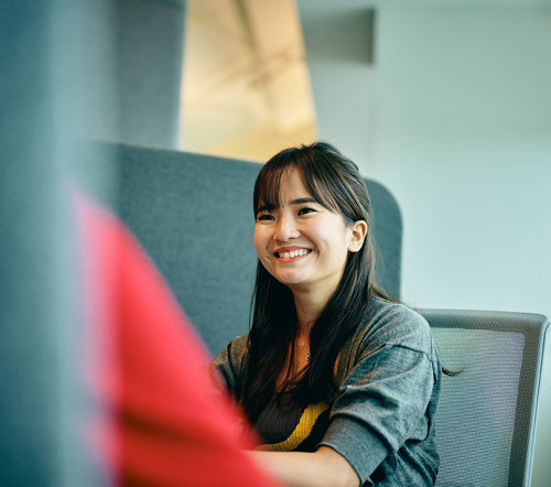 a woman smiling at someone