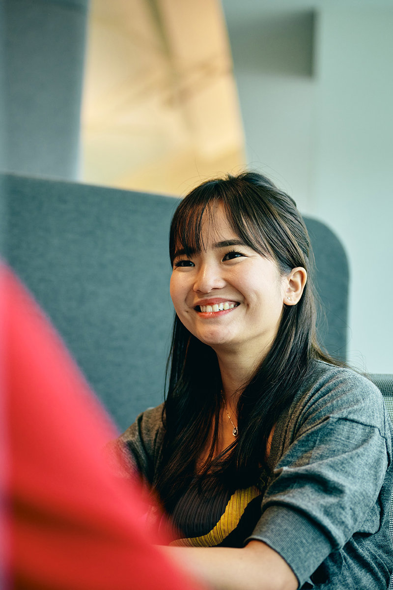 a woman smiling at someone
