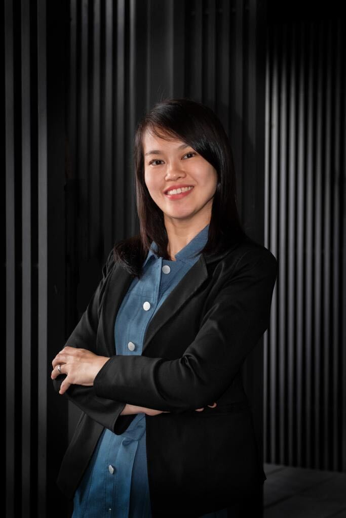 a woman in a black suit