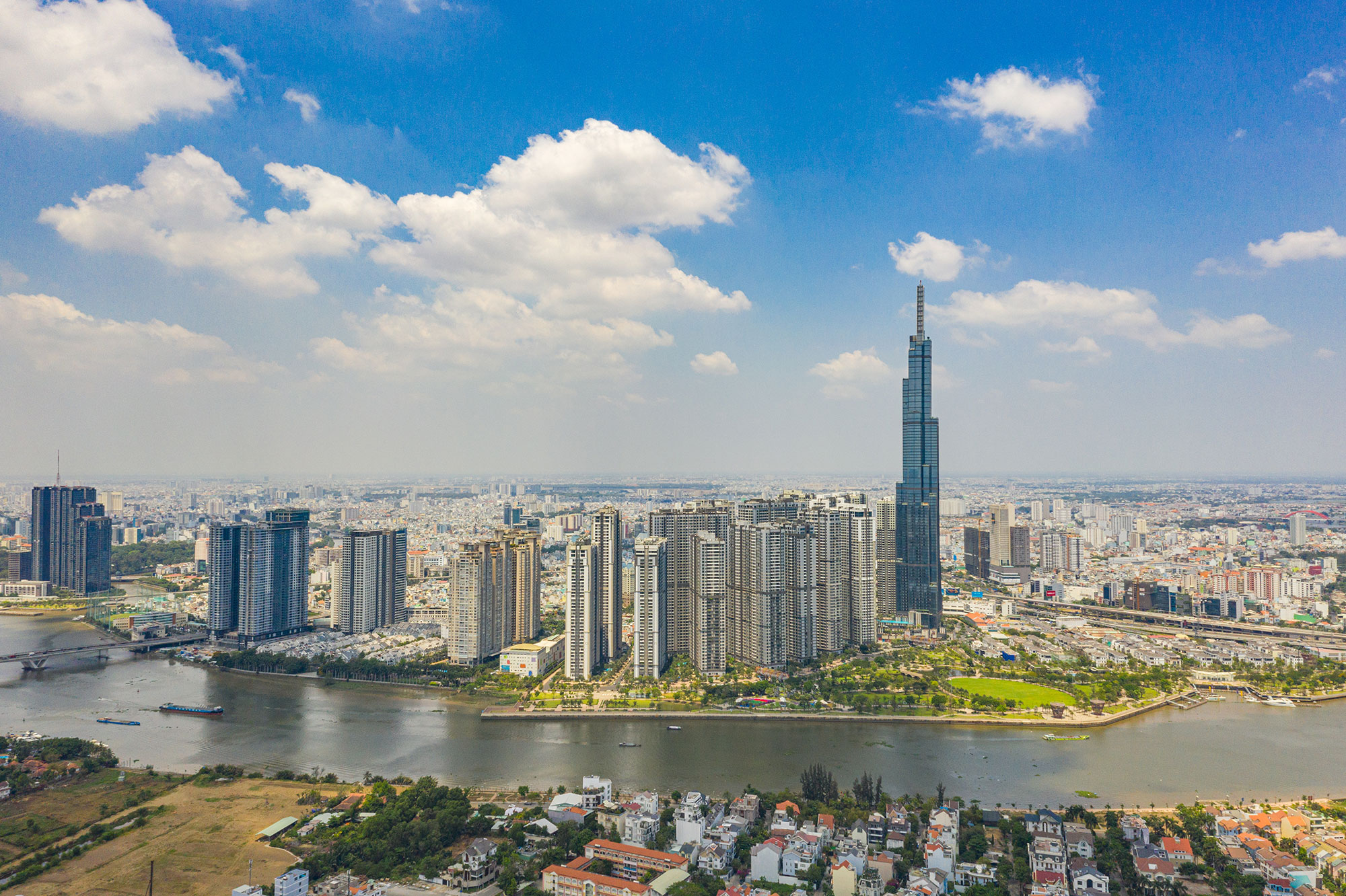 a city with tall buildings and a river