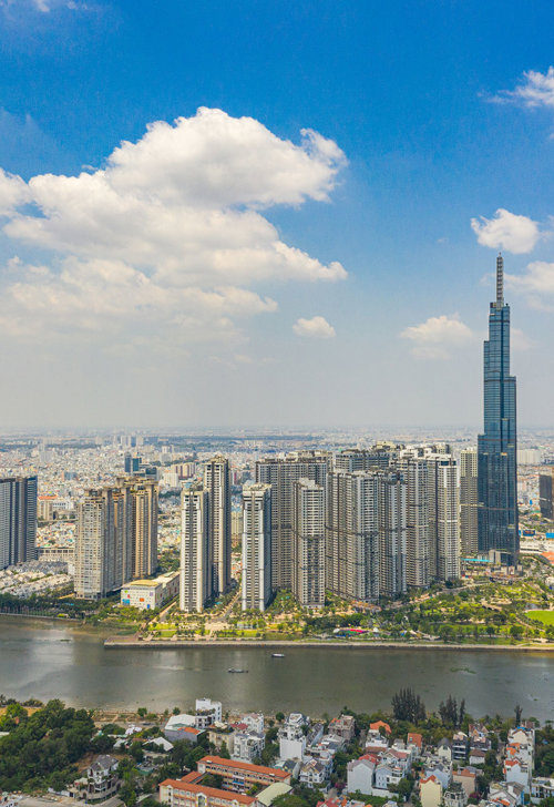 a city with tall buildings and a river