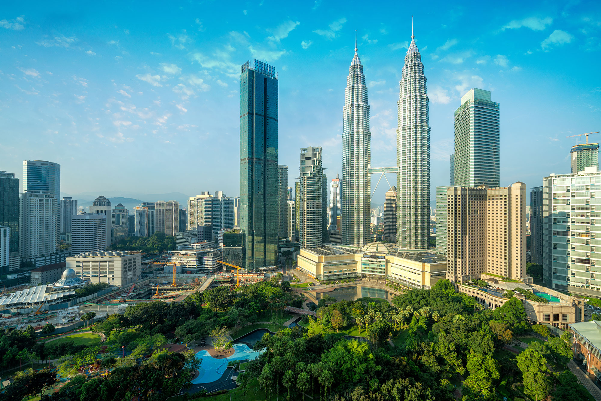 a city with tall buildings and trees