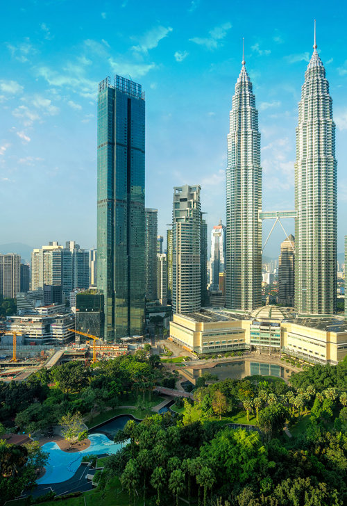 a city with tall buildings and trees