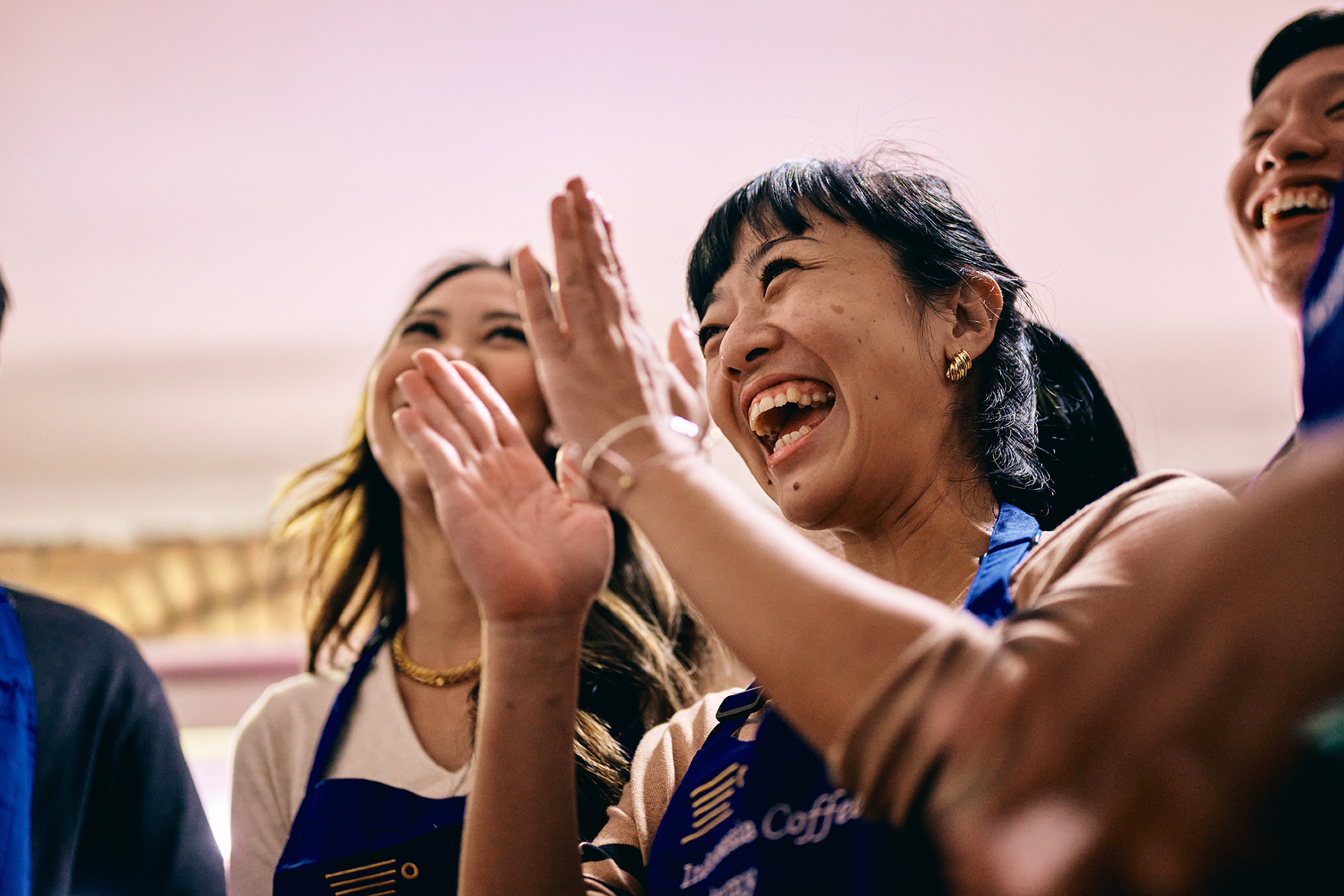 a group of women clapping their hands