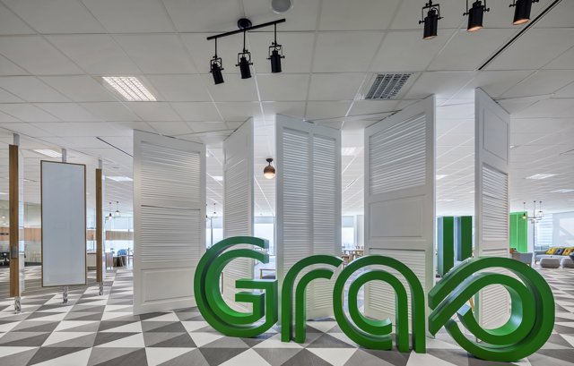 a room with white folding doors and green letters