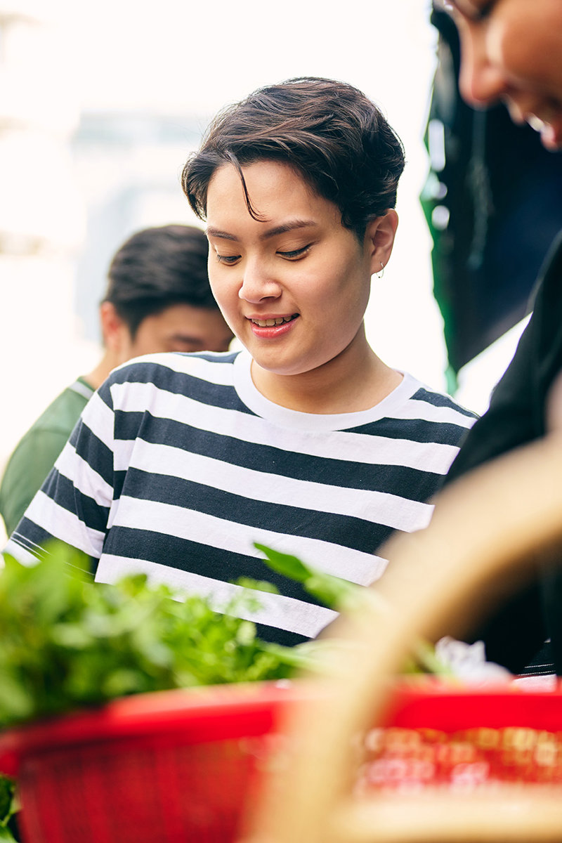 a woman looking at plants