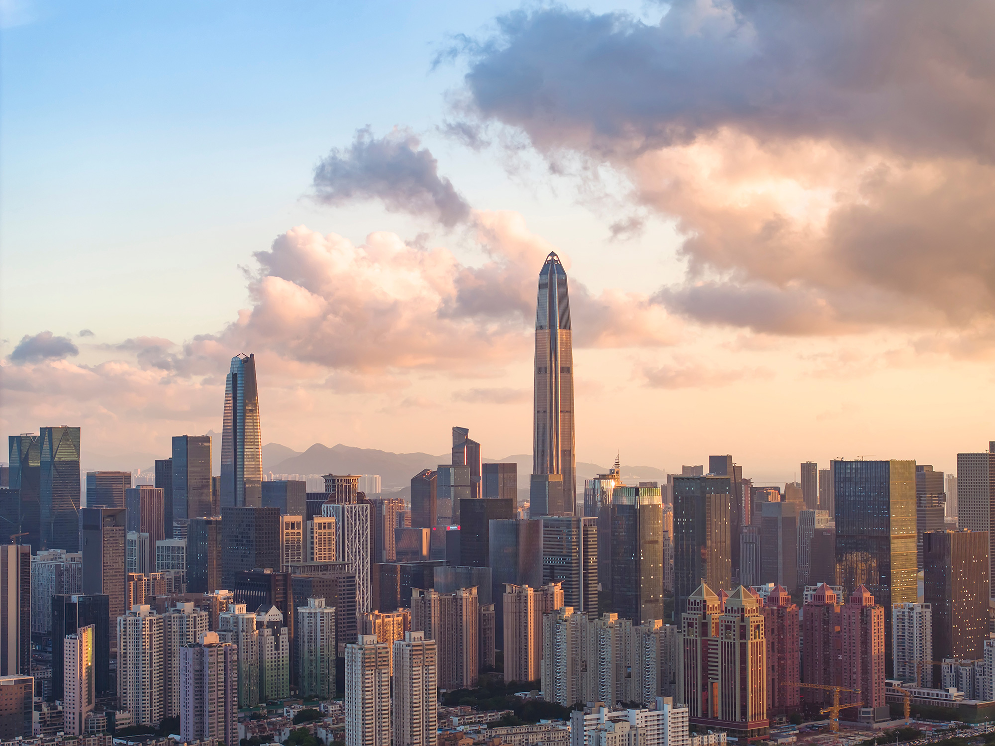 a city skyline with tall buildings