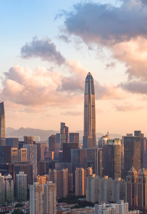 a city skyline with tall buildings