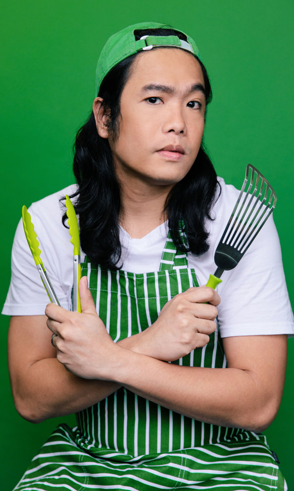 a man holding a kitchen utensil