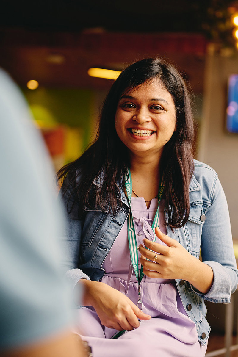 a woman smiling at a man