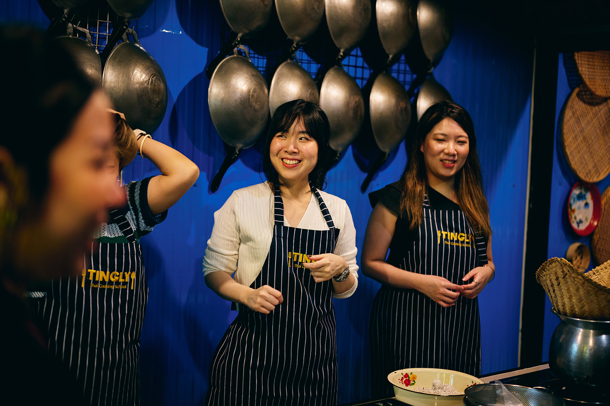 a group of women wearing aprons