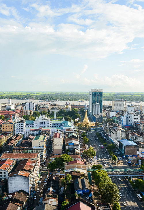 a city with many buildings and a road