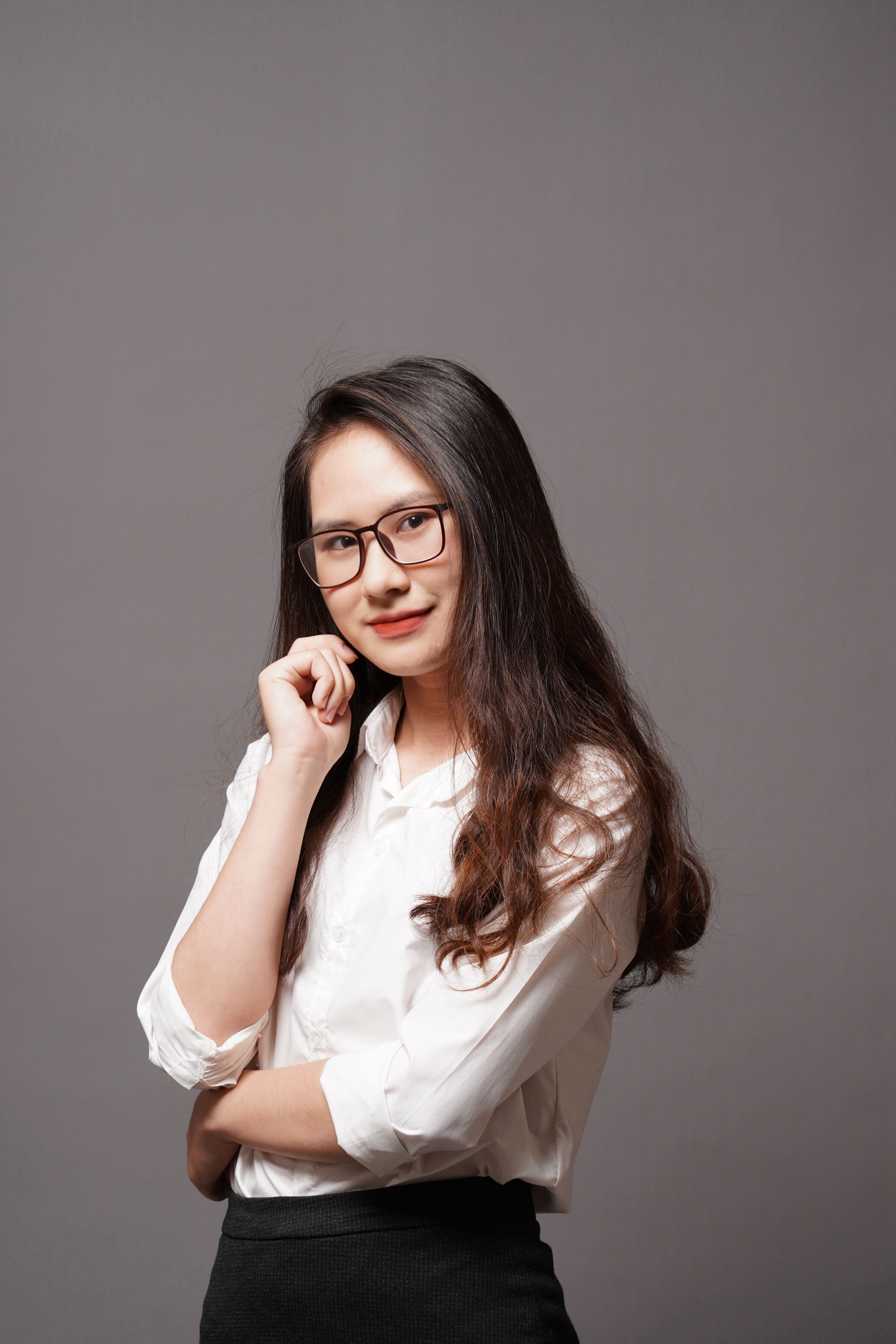 a woman with long hair wearing glasses