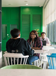 a group of people sitting at a table