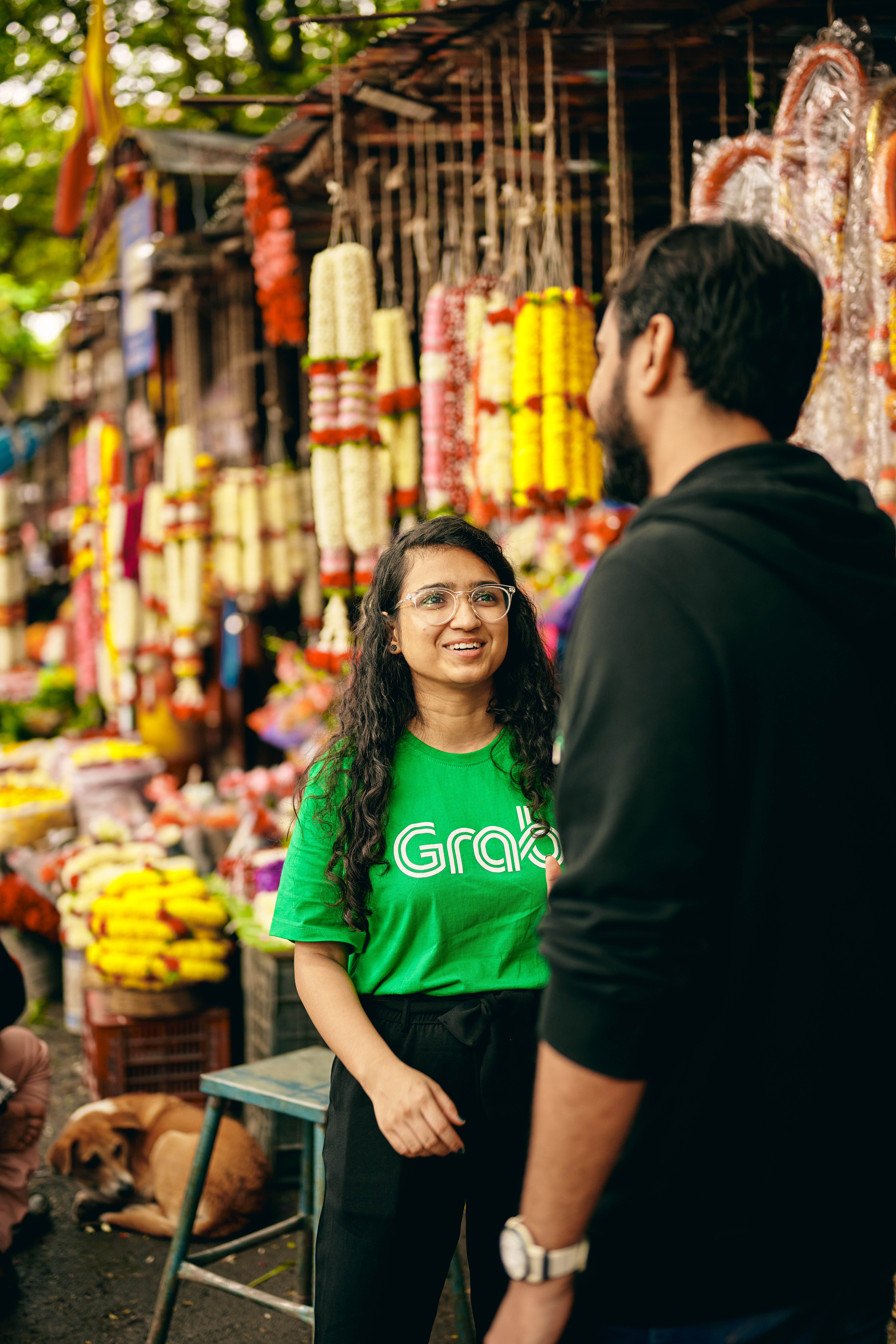 a person and person standing in a market