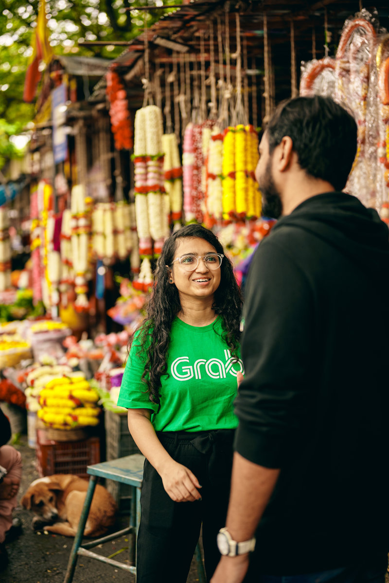 a person and person standing in a market